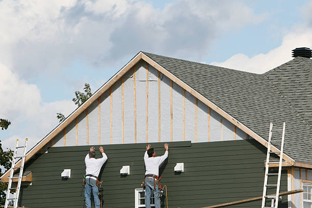 Professional Siding technician working in Penrose, NC
